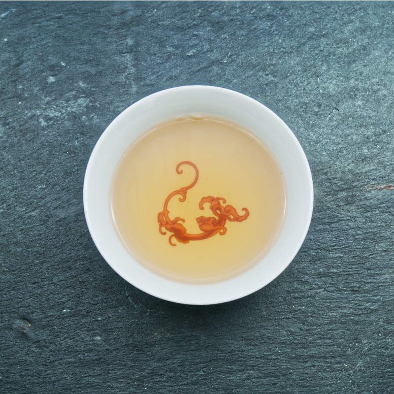 Tasse de Wo Jia à la liqueur jaune orangée